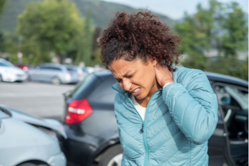 a woman with whiplash who needs a Douglasville car accident lawyer