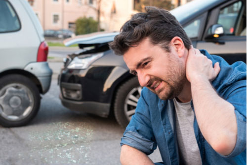 Man with whiplash who needs a Fairburn car accident lawyer
