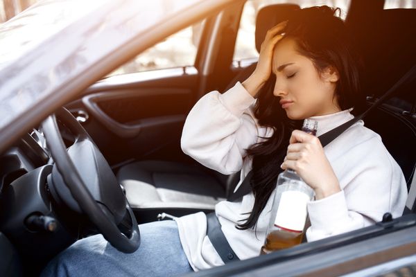 A woman drinking and driving that will cause someone to call a Union City Drunk Driving Accident Lawyer