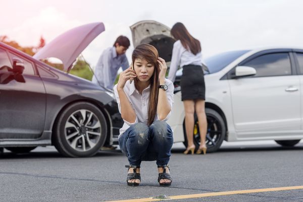 A woman on the phone after an accident