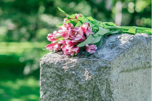 pink flowers on grave, concept of Union City wrongful death lawyer