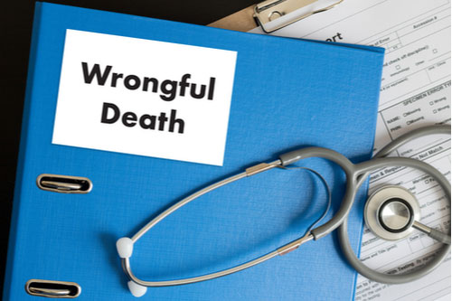 stethoscope and blue folder labeled wrongful death